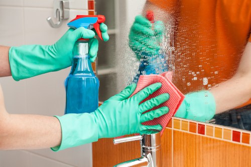 Professional office cleaners in SE5 maintaining a modern workspace