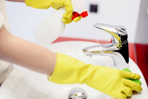 Professional carpet cleaner using safe methods with protective equipment